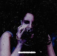 an image of a woman holding a glass of wine